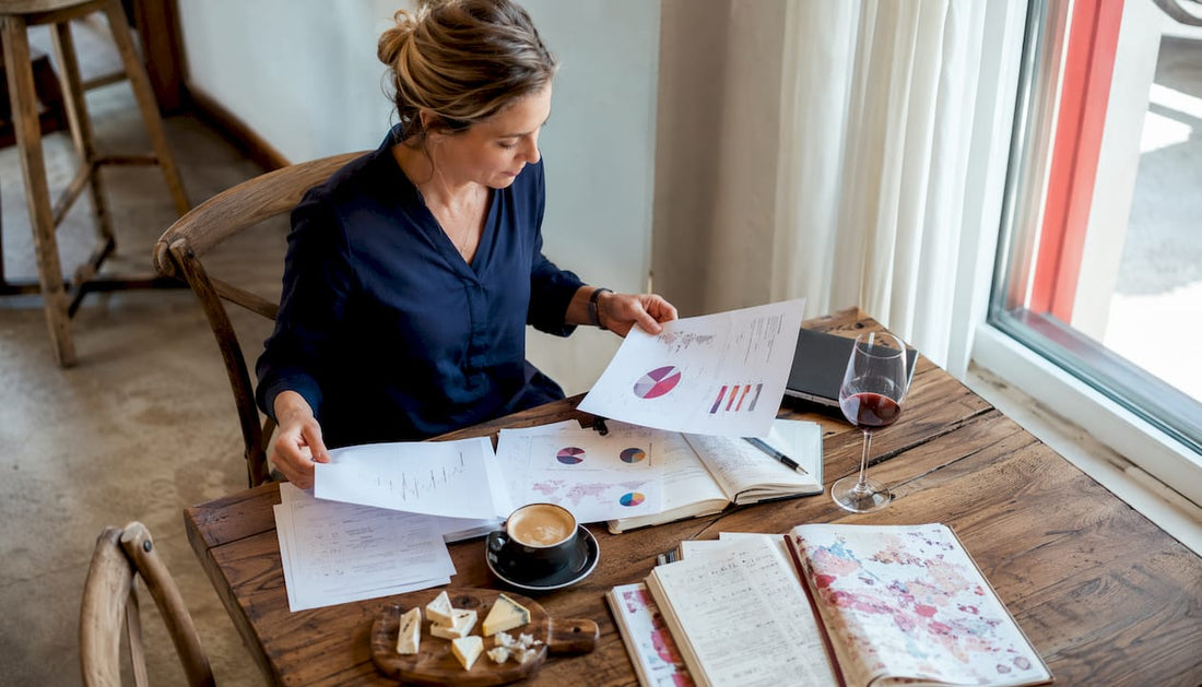 Wine professional reviewing reports in vineyard office