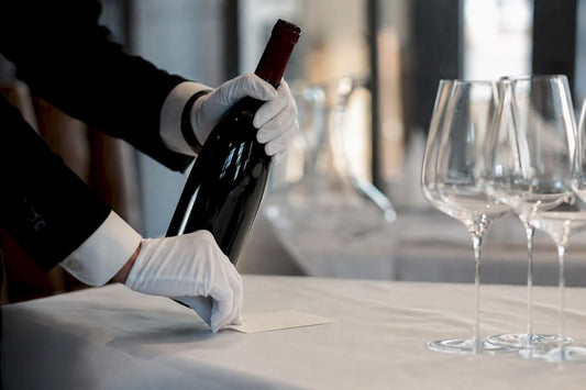 Close-up of wine bottle placed for charity auction