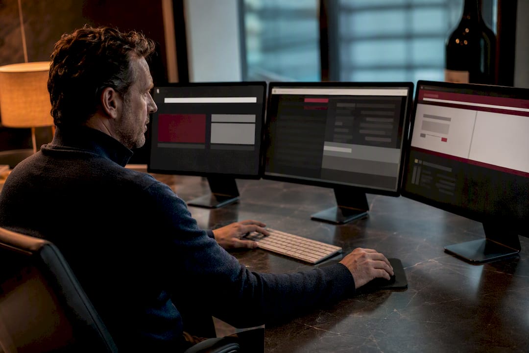 Three monitors tracking wine deal pages